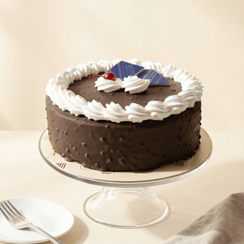Torta Sublime — Queque de chocolate con manjar y cobertura de chocolate.